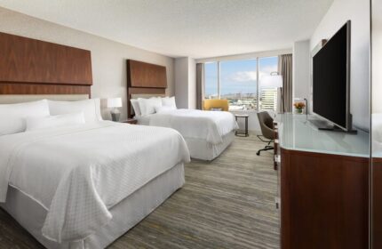 Gay-Friendly Hotel: The Westin Long Beach room with two beds, desk, TV, and a view. Ideal for gay men's travel to Long Beach, CA.