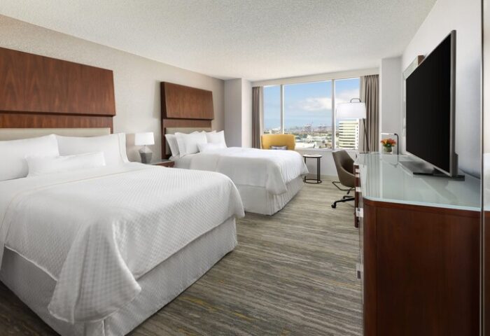Gay-Friendly Hotel: The Westin Long Beach room with two beds, desk, TV, and a view. Ideal for gay men's travel to Long Beach, CA.