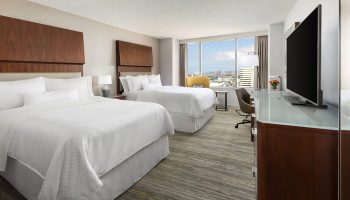 Gay-Friendly Hotel: The Westin Long Beach room with two beds, desk, TV, and a view. Ideal for gay men's travel to Long Beach, CA.