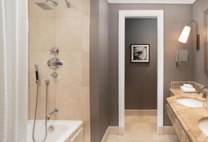 Bathroom at The Westin Palace, Madrid, a gay-friendly, pet-friendly hotel. Features a bathtub, shower, and double sink.
