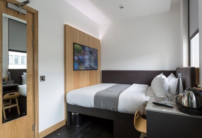 The Z Hotel City gay-friendly room. Modern decor, TV, bed, and amenities. Ideal for gay men travel. Stylish, comfortable, and inviting.