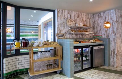 Breakfast buffet at The Z Hotel Piccadilly, a gay-friendly hotel. Juices, pastries, bread, cheese, and drinks are available. Ideal for gay travel.