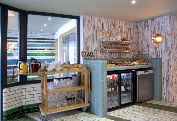 Breakfast buffet at The Z Hotel Piccadilly, a gay-friendly hotel. Juices, pastries, bread, cheese, and drinks are available. Ideal for gay travel.
