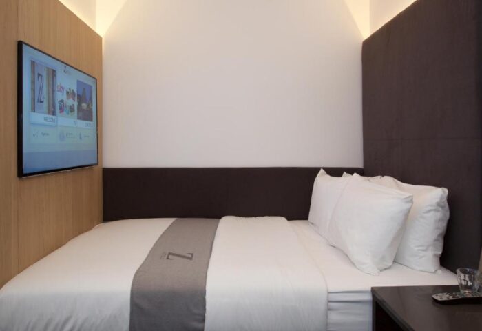The Z Hotel Shoreditch room. Gay-friendly hotel with bed, TV, and minimalist design. Ideal for gay men's travel in Shoreditch, London.