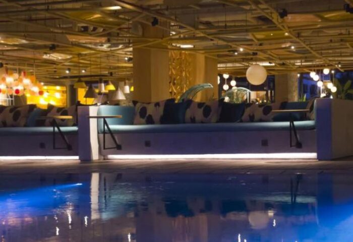 Tijili Hotel Seminyak pool view. Gay-friendly hotel with stylish design, comfy seating and vibrant lighting. Perfect for gay travel in Seminyak.