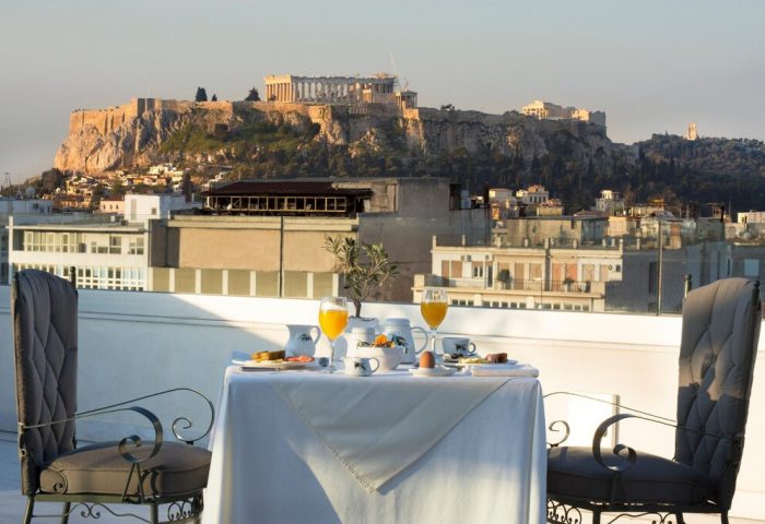 Breakfast with Acropolis view at Gay-Friendly Titania Hotel, Athens. Rooftop dining experience for gay men travelers. Greece vacation.