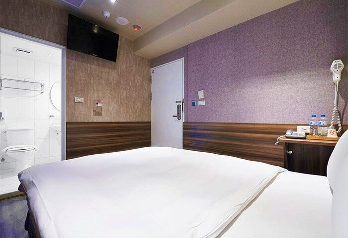 Tomorrow Hotel's gay-friendly room: bed, TV, bathroom. Modern design, comfortable for gay travelers. Perfect for your gay travel plans.