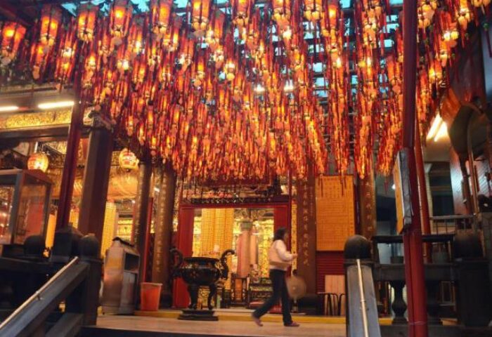 Tomorrow Hotel: Temple interior with hanging lanterns. Gay-friendly hotel travel advice for gay men. Lanterns at the temple.