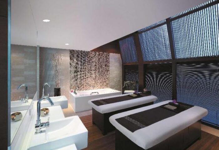 Traders Hotel Kuala Lumpur spa. Gay-friendly hotel with massage tables, bathtub, and sinks. Luxury travel for gay men.
