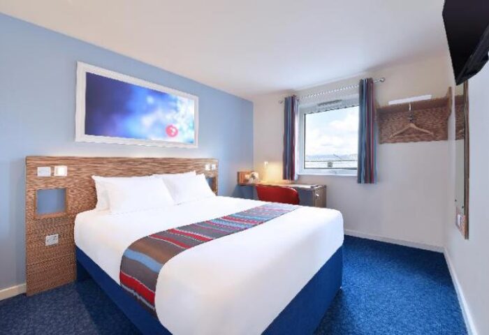 Travelodge London Central Southwark gay-friendly hotel room. Double bed, desk, and window. A comfortable stay for gay travelers in London.