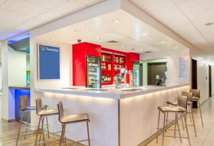 Travelodge London Vauxhall bar area. Gay-friendly hotel with bar stools, drinks, and a modern design. Pet-friendly Travelodge in London.