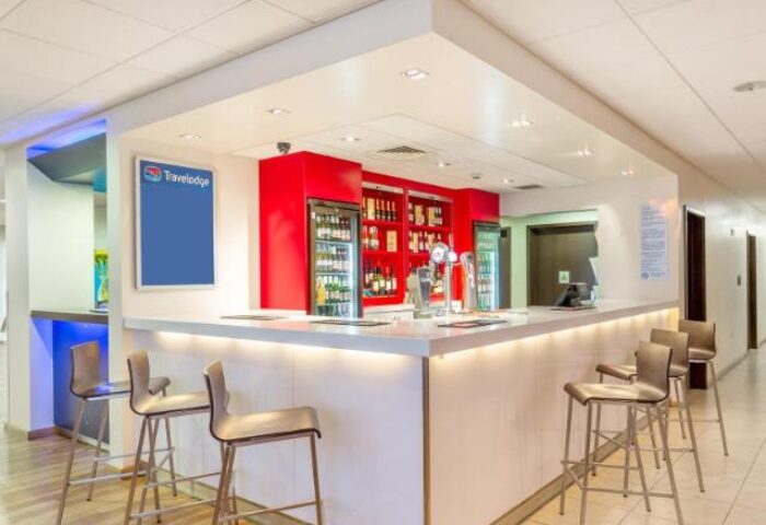 Travelodge London Vauxhall bar area. Gay-friendly hotel with bar stools, drinks, and a modern design. Pet-friendly Travelodge in London.