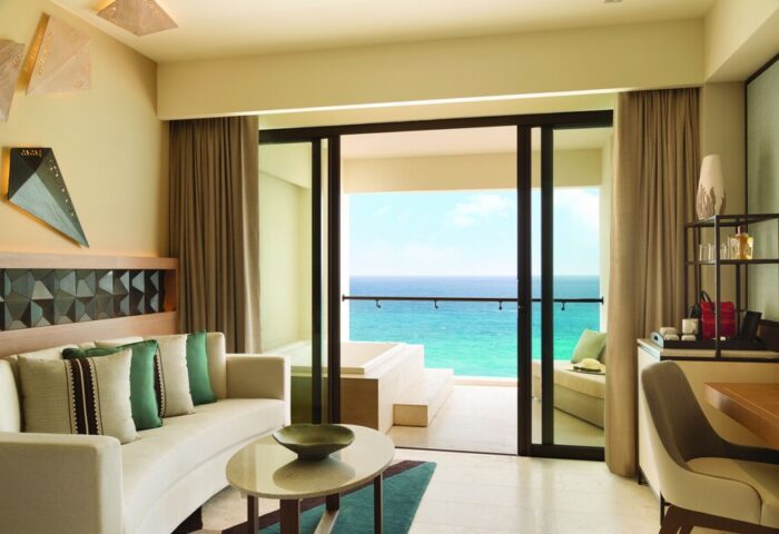 Turquoize at Hyatt Ziva Cancun adults-only all-inclusive gay-friendly hotel. Ocean view suite with balcony, seating area, and modern decor.
