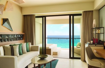 Turquoize at Hyatt Ziva Cancun adults-only all-inclusive gay-friendly hotel. Ocean view suite with balcony, seating area, and modern decor.