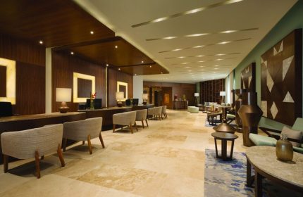 Lobby at Turquoize, Hyatt Ziva Cancun, an adults-only, all-inclusive, gay-friendly hotel. Reception and seating areas. Upscale design.