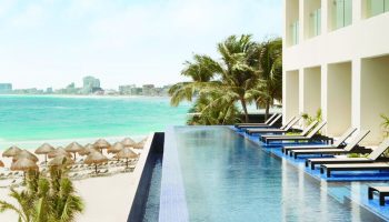 Turquoize at Hyatt Ziva Cancun adults-only all-inclusive resort. Infinity pool overlooking the beach. Gay-friendly hotel in Cancun, Mexico.