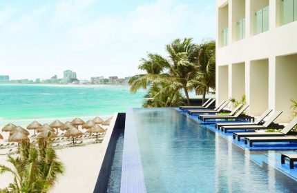 Turquoize at Hyatt Ziva Cancun adults-only all-inclusive resort. Infinity pool overlooking the beach. Gay-friendly hotel in Cancun, Mexico.
