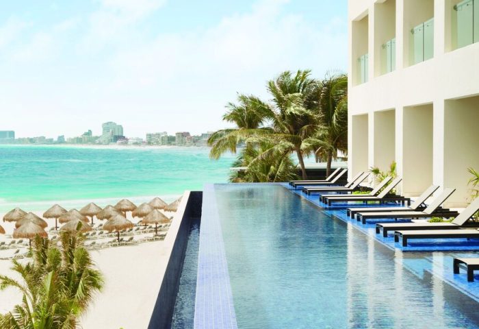 Turquoize at Hyatt Ziva Cancun adults-only all-inclusive resort. Infinity pool overlooking the beach. Gay-friendly hotel in Cancun, Mexico.