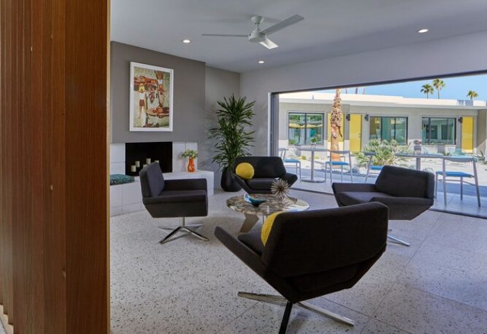 Living area at Twin Palms Resort, Palm Springs' newest gay men's resort. Modern design, open to patio. Gay-friendly hotel.