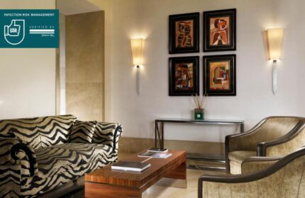 UNAHOTELS Decò Roma gay-friendly hotel: Pet-friendly lounge area with zebra-striped sofa, armchairs, and artwork. Stylish, comfortable space.