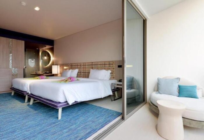 Gay-Friendly Hotel Veranda Resort Pattaya MGallery: Twin beds, balcony, and modern design create a welcoming space for gay travelers.