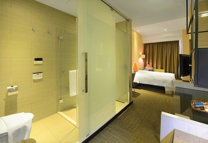 Via Hotel Taipei Station room. Modern design, glass shower, and comfortable bed. A gay-friendly hotel option in Taipei, Taiwan.
