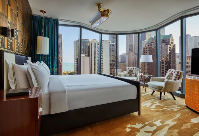 Viceroy Chicago hotel room with city view. Gay-friendly hotel features modern decor, luxurious bedding, and stunning views of the Chicago skyline.