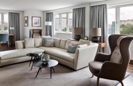 Vienna Marriott Hotel's gay-friendly room. A spacious suite with a couch, chair, and city views. Perfect for gay travelers in Vienna.