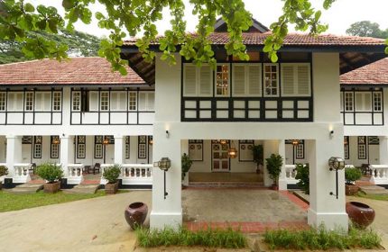 Villa Samadhi Singapore by Samadhi: Exterior view of the gay-friendly hotel. White facade, black trim, and lush greenery. A tranquil retreat.