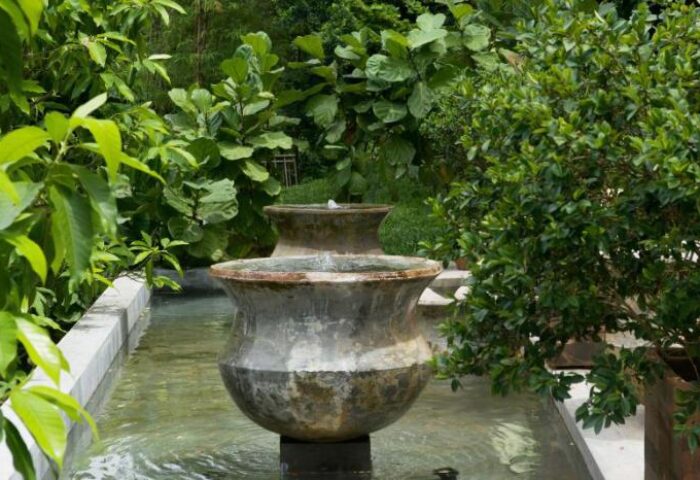 Villa Samadhi Singapore by Samadhi: Water feature in the gay-friendly hotel's lush garden. A serene oasis for gay travelers.