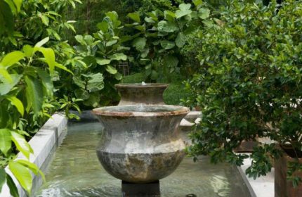 Villa Samadhi Singapore by Samadhi: Water feature in the gay-friendly hotel's lush garden. A serene oasis for gay travelers.