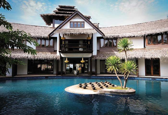 Villa Samadhi by Samadhi, a gay-friendly hotel. Exterior view of the villa with a pool and tropical landscaping. Ideal for gay travel.