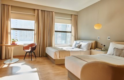 Virgin Hotels Chicago guest room with two beds. Gay-friendly hotel featuring modern design, city views, and comfortable accommodations.