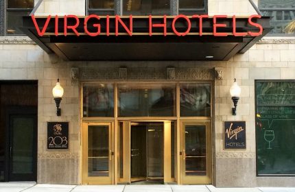 Virgin Hotels Chicago entrance. This gay-friendly hotel features modern design and is a great choice for LGBTQ+ travelers visiting Chicago.