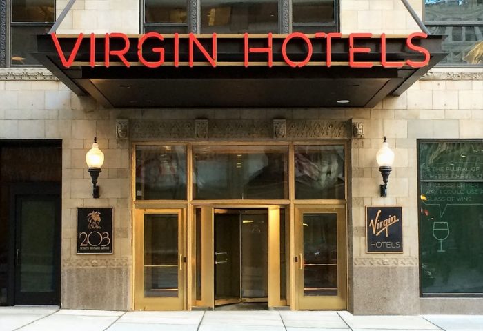 Virgin Hotels Chicago entrance. This gay-friendly hotel features modern design and is a great choice for LGBTQ+ travelers visiting Chicago.