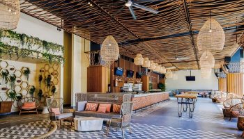 Virgin Hotels Las Vegas, Curio Collection by Hilton interior. Gay-friendly hotel with unique design, woven ceiling, and stylish seating.