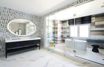 Virgin Hotels Las Vegas bathroom. Curio Collection by Hilton gay-friendly hotel features a modern design with a soaking tub and glass shower.