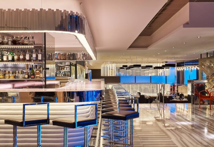 W Chicago Lakeshore gay-friendly hotel bar. Chic interior, stylish bar stools, and a well-stocked liquor shelf. Modern design.