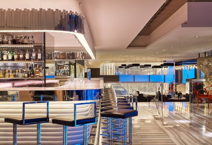 W Chicago Lakeshore gay-friendly hotel bar. Chic interior, stylish bar stools, and a well-stocked liquor shelf. Modern design.