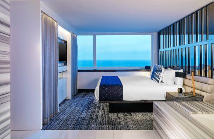 W Chicago Lakeshore gay-friendly hotel room with lake view. Modern design, comfortable bed, and stylish decor for gay travelers.