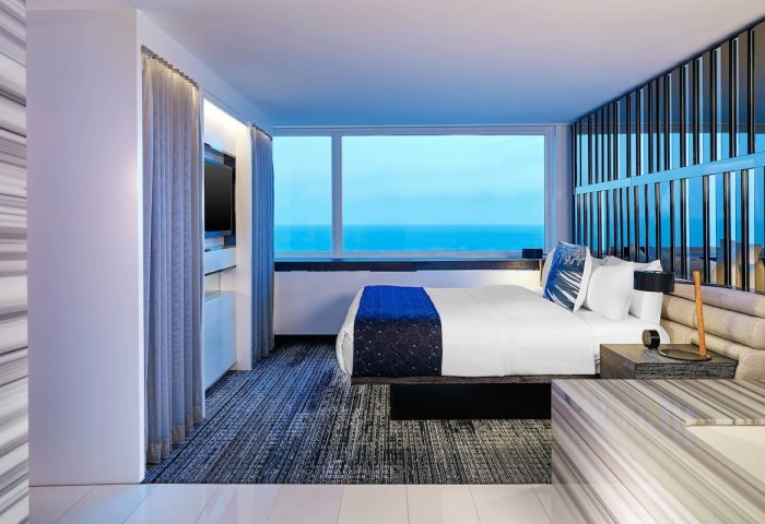 W Chicago Lakeshore gay-friendly hotel room with lake view. Modern design, comfortable bed, and stylish decor for gay travelers.