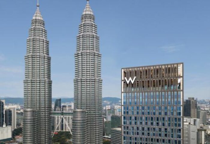 W Kuala Lumpur, a gay-friendly hotel, with the Petronas Twin Towers in the background. A great choice for gay travelers visiting Kuala Lumpur.