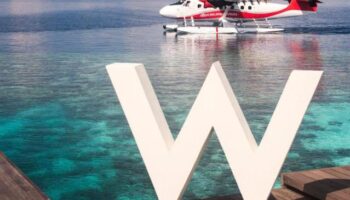 W Maldives gay-friendly hotel: Seaplane arrival at the W Maldives resort, a luxury destination perfect for gay travelers seeking paradise.