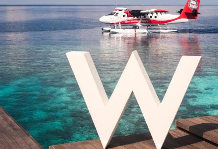 W Maldives gay-friendly hotel: Seaplane arrival at the W Maldives resort, a luxury destination perfect for gay travelers seeking paradise.