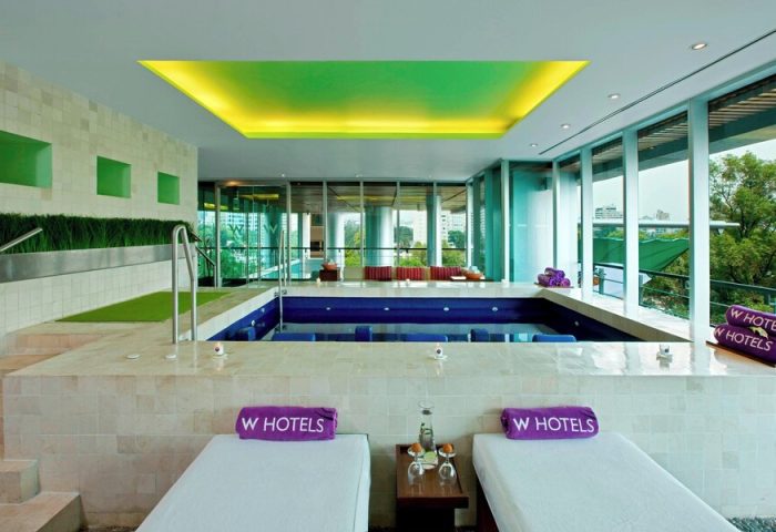 W Mexico City gay-friendly hotel spa. Lounge chairs and a pool with views. Perfect for gay travelers seeking luxury in Mexico City.