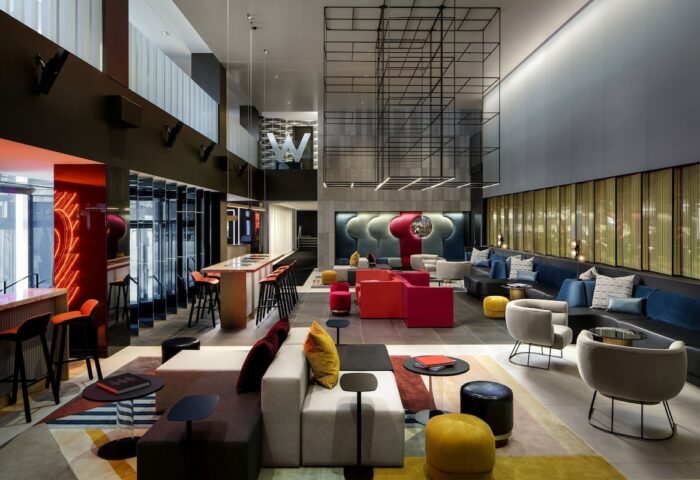 W Montréal gay-friendly hotel lobby. Stylish interior with colorful seating, bar, and modern design. A great choice for gay travelers.