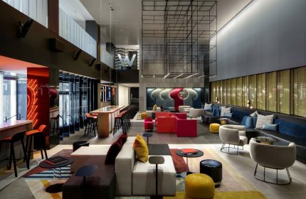 W Montréal gay-friendly hotel lobby. Stylish interior with colorful seating, bar, and modern design. A great choice for gay travelers.