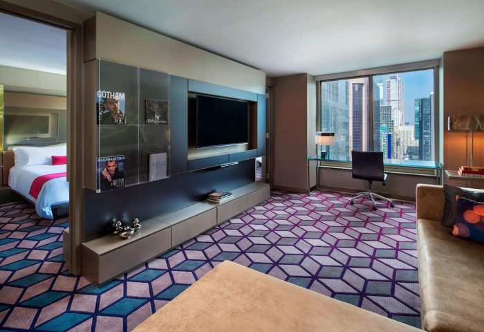W New York Times Square hotel room. Modern design, TV, desk with city view. Gay-friendly hotel for gay men travel in NYC.
