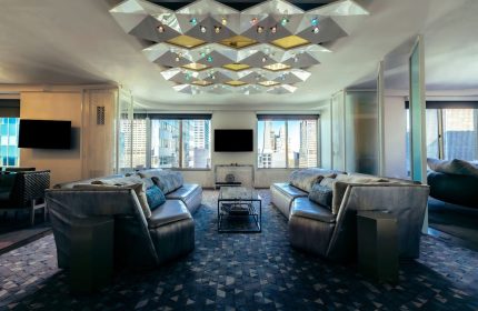 W New York Times Square hotel suite. The gay-friendly hotel features modern decor, city views, and stylish lounge seating.