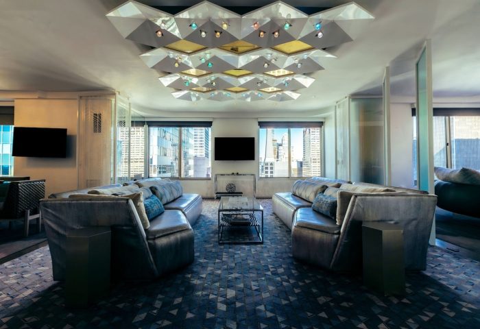 W New York Times Square hotel suite. The gay-friendly hotel features modern decor, city views, and stylish lounge seating.